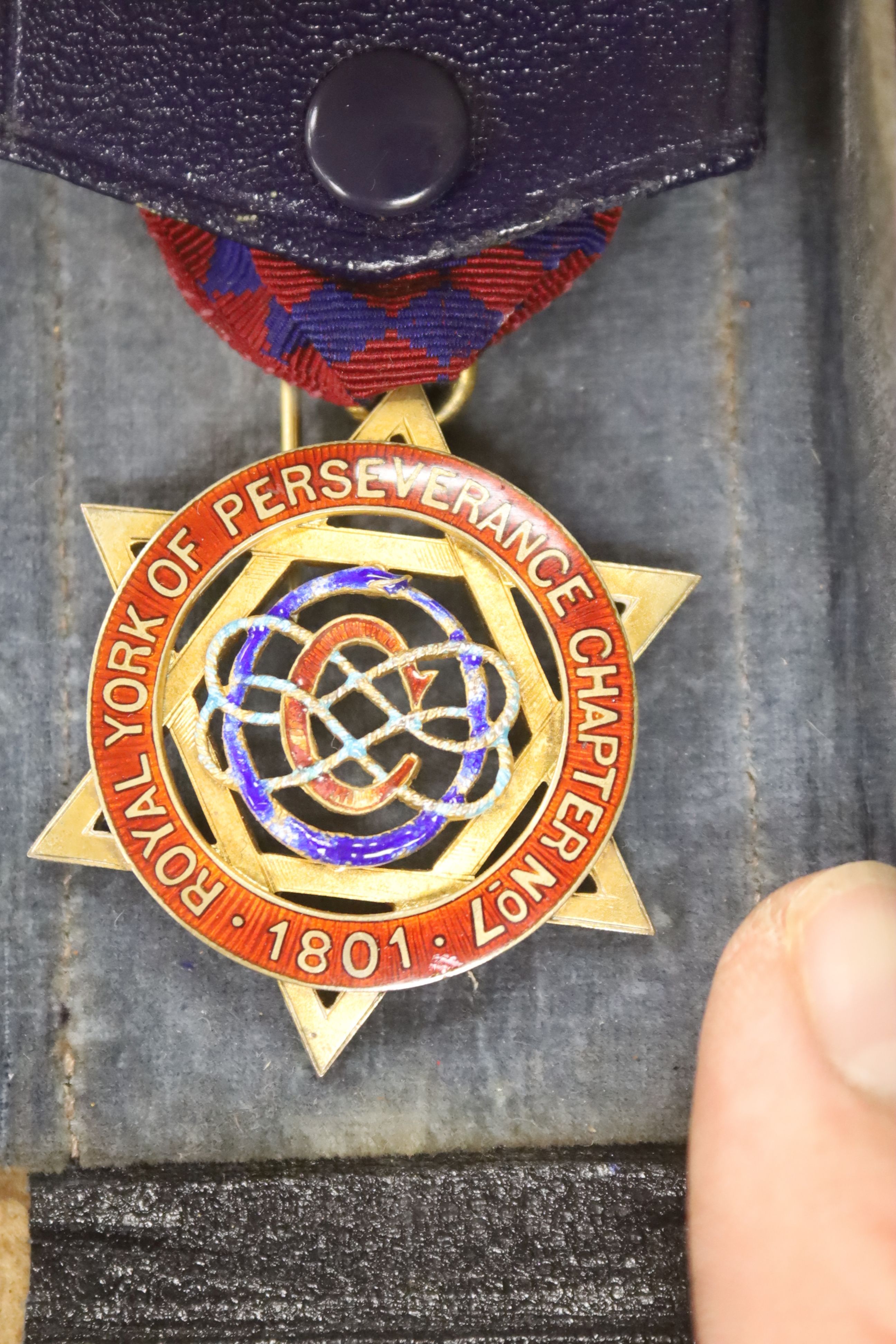 Twenty two silver gilt and enamelled Masonic medallions